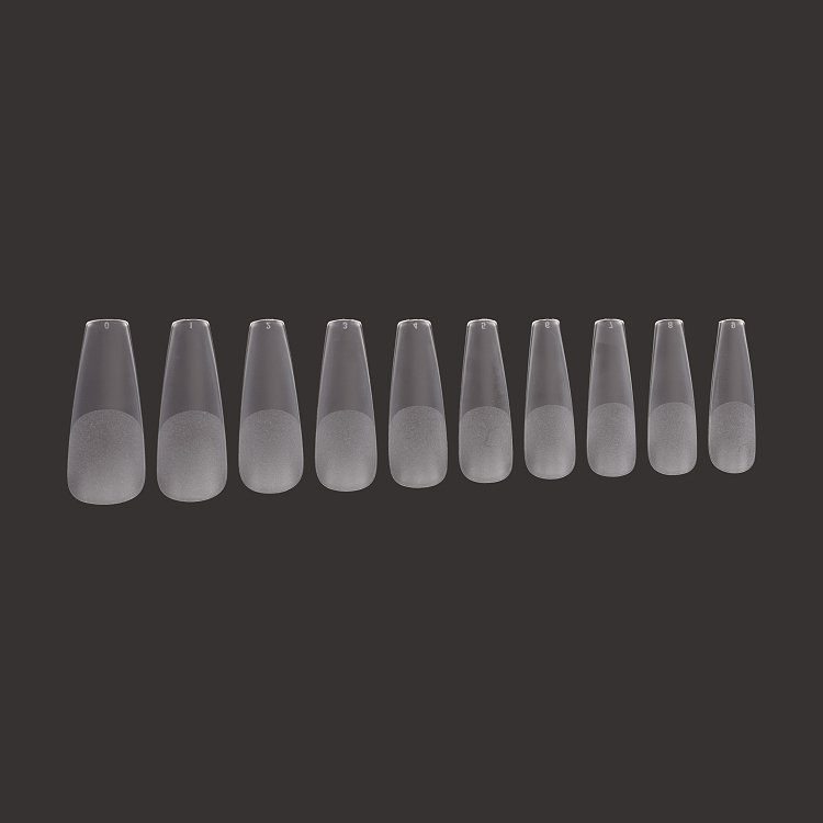 Christian Artesio transparent soft gel tips in coffin shape for professional nail extension.